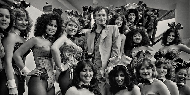 Playboy impresario Hugh Hefner (1926 - 2017) with a group of Playboy Bunnies at the Grand Opening of the Playboy Hotel-Casino in Atlantic City, New Jersey, circa 1981.