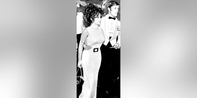 Capt. Galand Kramer and his date, Playboy magazine model Miki Garcia, at a White House dinner honoring returned prisoners of war. Photographed May 24, 1973, in Washington, D.C.