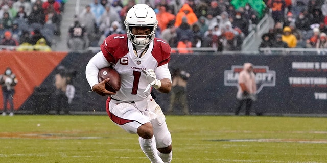 Arizona Cardinals quarterback Kyler Murray carries the ball during the first half of an NFL football game against the Chicago Bears Sunday, Dec. 5, 2021, in Chicago.