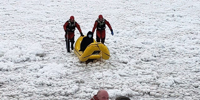 Rescuers pull the student to safety