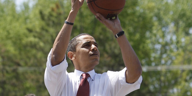 US Democratic presidential candidate Illinois Senator Barack Obama plays basketball at Riverview High School in Elkhart, Indiana, on May 04, 2008.