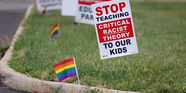 Signs opposing Critical Race Theory line the entrance to the Loudoun County School Board headquarters, in Ashburn, Virginia, U.S. June 22, 2021. 