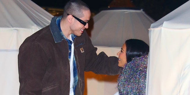 Kim Kardashian and Pete Davidson share a loving glance as they enjoy an early Valentine's weekend date night at Lilia in Brooklyn.