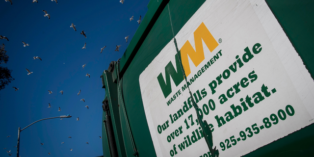 Birds fly above the Waste Management Inc. Davis Street Recycling &amp; Transfer Station in San Leandro, California, U.S., on Monday, Feb. 12, 2018. 