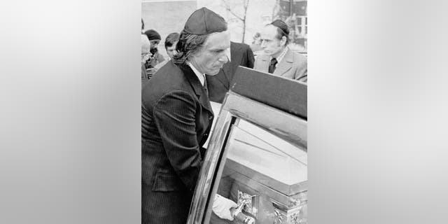 Hugh Hefner helps carry the casket containing the body of his executive secretary Bobbie Arnstein. The 32-year-old, who was serving a 15-year prison sentence on federal drug charges and was free pending her appeal and a court ordered psychiatric examination, committed suicide. 