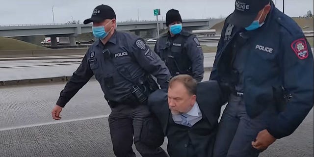 Pastor Artur Pawlowski is arrested by Calgary police in the middle of a highway on his way home from church on May 8, 2021.