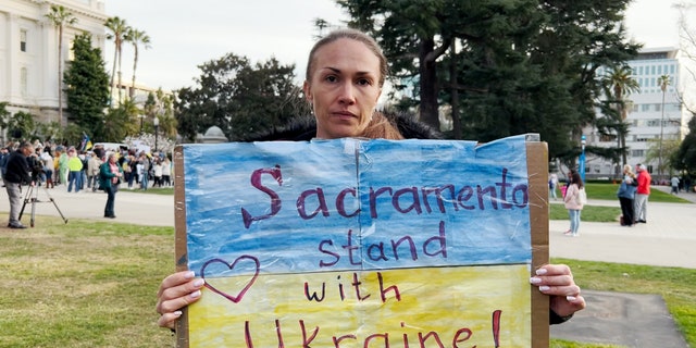 Olga, a Ukrainian citizen who lives in Sacramento, Calif., shows her support for her homeland during a rally Feb. 24, 2022. 