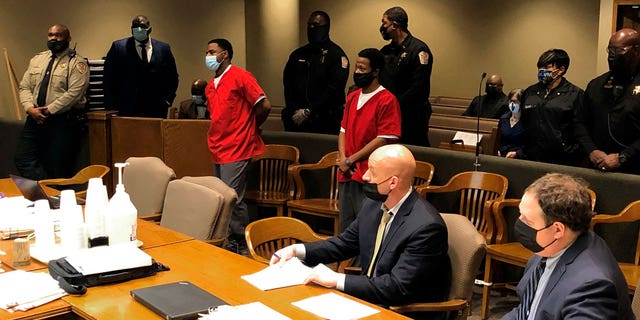 From left, Justin Johnson and Cornelius Smith appear before a judge during a court hearing related to the fatal shooting of rapper Young Dolph Friday, Feb. 11, 2022, in Memphis, Tenn. Lawyers for Johnson and Smith said their clients were not guilty during a Friday hearing. Johnson and Smith were indicted in January in the Nov. 17 killing of Young Dolph, whose real name was Adolph Thornton Jr. 