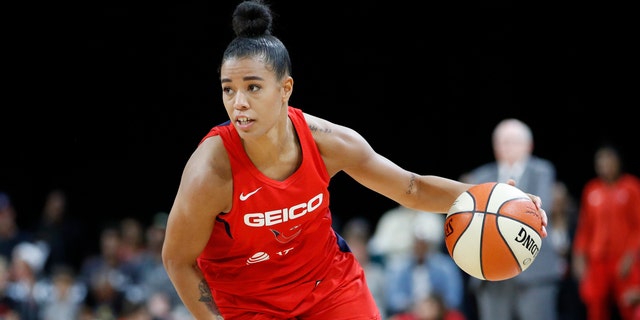 In this Sept. 24, 2019, file photo, Washington Mystics' Natasha Cloud drives up the court against the Las Vegas Aces during the second half of Game 4 of a WNBA playoff basketball in Las Vegas. 
