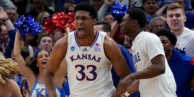 Kansas' David McCormack reacts after making a shot and being fouled in the Elite 8 round of the NCAA tournament Sunday, March 27, 2022, in Chicago.