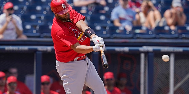 St. Louis Cardinals' Albert Pujols singles in the fourth inning of a spring training baseball game against the Washington Nationals, Wednesday, March 30, 2022, in West Palm Beach, Fla. 