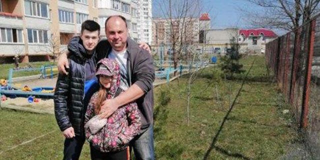 Kozlov's dad volunteered to fight in the Ukrainian army, which Kozlov said made him "extremely proud" of his dad. Kozlov is pictured with his dad and his sister here.