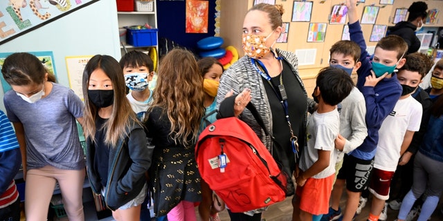 Third-grade students prepare to exit their classroom at Pacific Elementary School in Manhattan Beach on Oct. 21, 2021. (Brittany Murray/MediaNews Group/Long Beach Press-Telegram via Getty Images)