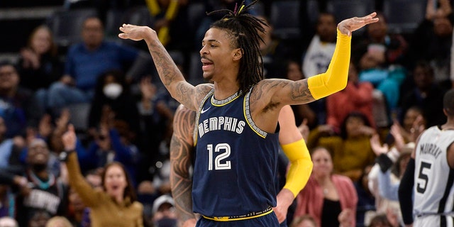 Memphis Grizzlies guard Ja Morant reacts during the first half of the team's NBA basketball game against the San Antonio Spurs on Monday, Feb. 28, 2022, in Memphis, Tenn.