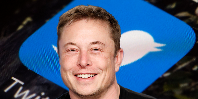 SpaceX founder Elon Musk smiles at a press conference following the first launch of a SpaceX Falcon Heavy, U.S., February 6, 2018. REUTERS/Joe Skipper and file photo of the Twitter app icon . 