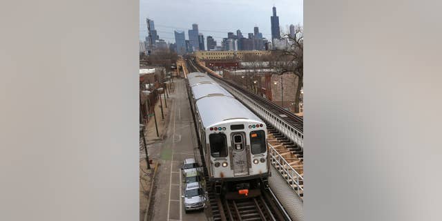 A Chicago Transit Authority Green Line train travels West away from downtown Chicago, Thursday, March 23, 2017, in Chicago. 