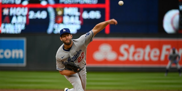Los Angeles Dodgers pitcher Clayton Kershaw throws against the Minnesota Twins during the first inning Wednesday, April 13, 2022, in Minneapolis.