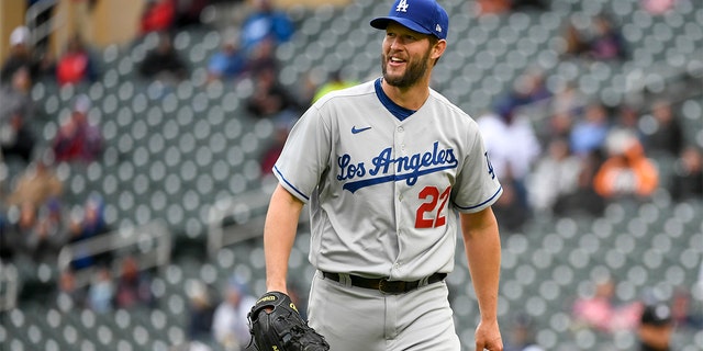 Los Angeles Dodgers pitcher Clayton Kershaw heads to the dugout after the final out of the seventh inning of a game against the Minnesota Twins, Wednesday, April 13, 2022, in Minneapolis. 