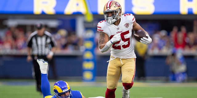 Elijah Mitchell of the San Francisco 49ers runs after making a catch against the Los Angeles Rams at SoFi Stadium on Jan. 30, 2022 in Inglewood, California.