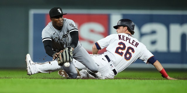 Tim Anderson #7 of the Chicago White Sox fields the ball as Max Kepler #26 of the Minnesota Twins slides safely into second base in the seventh inning of the game at Target Field on April 22, 2022 in Minneapolis, Minnesota. The Twins defeated the White Sox 2-1. 