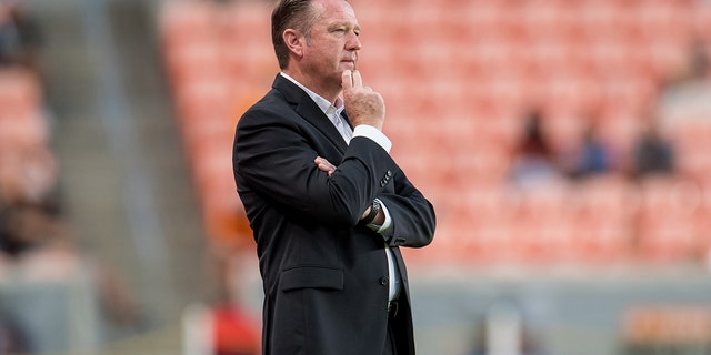 Houston Dash head coach James Clarkson watches during a game between North Carolina Courage and Houston Dash at BBVA Stadium on October 10, 2021, in Houston, Texas.