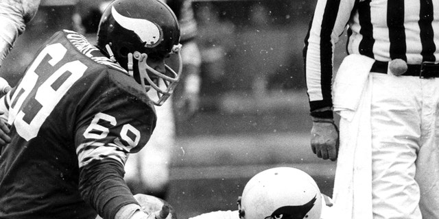 Football: St. Louis Cardinals QB Jim Hart (17) after sack by Minnesota Vikings Doug Sutherland (69) at Metropolitan Stadium. Bloomington, MN 12/21/1974