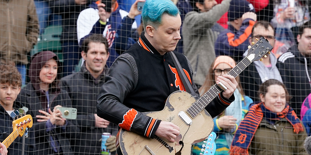 FILE - Musician Jack White performs the national anthem before the first inning of a baseball game between the Detroit Tigers and the Chicago White Sox, Friday, April 8, 2022, in Detroit. White surprised fans by marrying musician Olivia Jean on stage during his Detroit homecoming show Friday. The Detroit-born singer, songwriter and producer invited Jean onstage to join his performance and introduced her as his girlfriend. (AP Photo/Carlos Osorio, File)