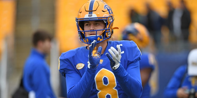 Kenny Pickett #8 of the Pittsburgh Panthers warms up before the game against the Miami Hurricanes at Heinz Field on October 30, 2021 in Pittsburgh, Pennsylvania.