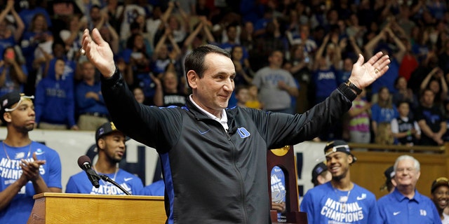 Duke coach Mike Krzyzewski recognizes the crowd during a homecoming celebration for the national championship Duke basketball team at Cameron Indoor Stadium, April 7, 2015, in Durham, N.C. 