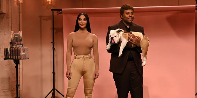 Kim Kardashian and Kenan Thompson are seen performing a "Skims" sketch during "Saturday Night Live" on October 9, 2021.