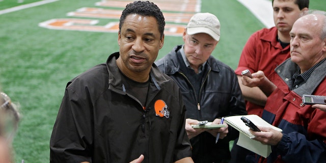 Cleveland Browns defensive coordinator Ray Horton talks to reporters after practice at the team's facility in Berea, Ohio, Dec. 19, 2013.