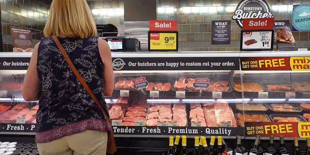 A customer shops for meat at a supermarket on June 10, 2021, in Chicago, Illinois.