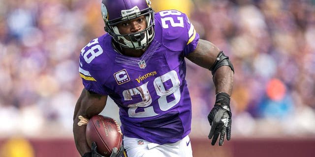 Sep 20, 2015; Minneapolis, MN, USA; Minnesota Vikings running back Adrian Peterson (28) rushes with the ball in the second half against the Detroit Lions at TCF Bank Stadium.