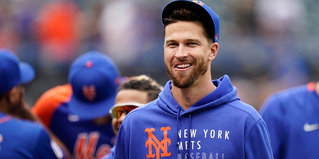 FILE - New York Mets pitcher Jacob DeGrom smiles after the team's baseball game against the Washington Nationals on Aug. 29, 2021, in New York.