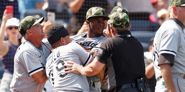 Tim Anderson of the Chicago White Sox is held back after a benches-clearing dispute at Yankee Stadium on May 21, 2022, in the Bronx.