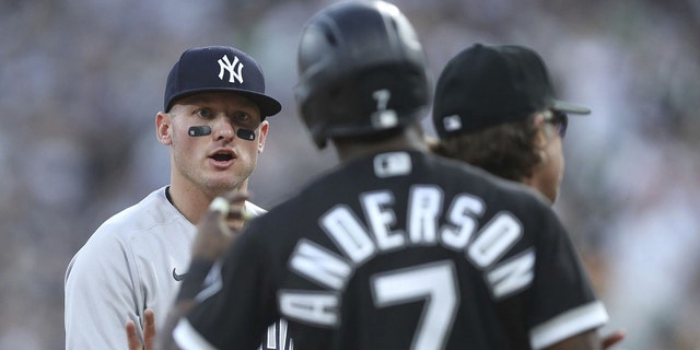 New York Yankees third baseman Josh Donaldson and White Sox baserunner Tim Anderson exchange words on May 13, 2022, at Guaranteed Rate Field in Chicago.
