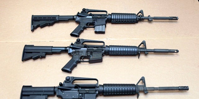 In this Aug. 15, 2012 file photo, three variations of the AR-15 rifle are displayed at the California Department of Justice in Sacramento, Calif. 