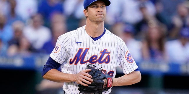 New York Mets starting pitcher Jacob deGrom reacts during the first inning of a baseball game against the Chicago Cubs Wednesday, June 16, 2021, in New York.