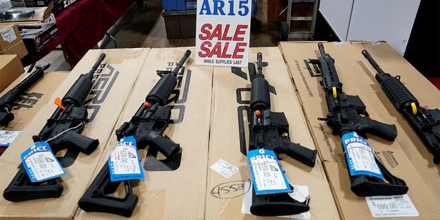FILE PHOTO: AR-15 rifles are displayed for sale at the Guntoberfest gun show in Oaks, Pennsylvania, U.S., October 6, 2017. REUTERS/Joshua Roberts/File Photo