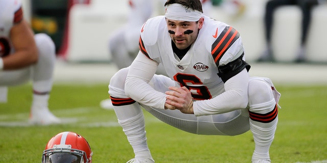 Cleveland Browns' Baker Mayfield warms up before an NFL football game against the Green Bay Packers Saturday, Dec. 25, 2021, in Green Bay, Wis.