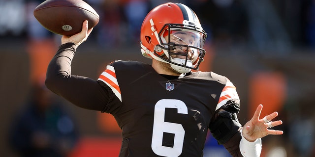 Cleveland Browns quarterback Baker Mayfield throws during the first half of an NFL football game against the Baltimore Ravens, Sunday, Dec. 12, 2021, in Cleveland.