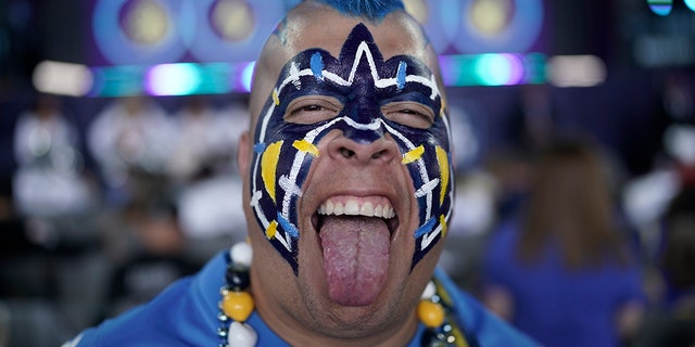 Los Angeles Chargers fan Guillermo Sandoval poses for a portrait before the second round of the NFL draft, April 29, 2022, in Las Vegas.