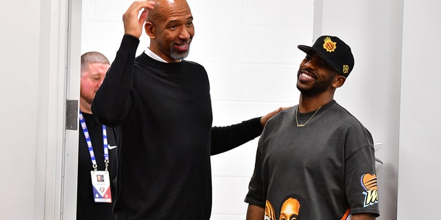 Head Coach Monty Williams of the Suns talks with Chris Paul after the 2022 NBA Playoffs Western Conference Semifinals on May 10, 2022, at Footprint Center in Phoenix, Arizona.