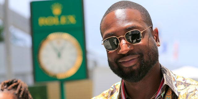 Former NBA player Dwayne Wade walks through the paddock prior to the first running of the Crypto.com Miami Grand Prix on May 8, 2022 at the Miami International Autodrome in Miami Gardens, Florida.