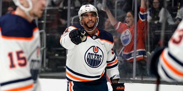 Edmonton Oilers left wing Evander Kane, center, celebrates his goal during the third period in Game 3 of an NHL hockey Stanley Cup first-round playoff series against the Los Angeles Kings Friday, May 6, 2022, in Los Angeles. It was his third goal of the game. 