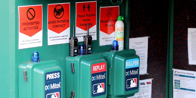 A detail shot of the Mitel Press, Replay and Bullpen phones and the social distancing signs in the dugout prior to the game between the New York Yankees and the Washington Nationals at Nationals Park on Thursday, July 23, 2020, in Washington, District of Columbia. 