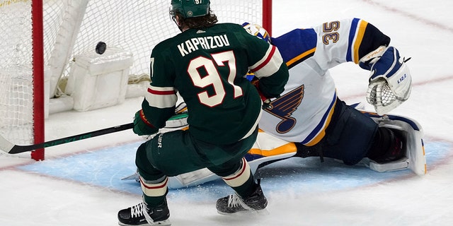 Minnesota Wild's Kirill Kaprizov (97) scores his third goal of the night, against St. Louis Blues goalie Ville Husso during the third period of Game 2 of an NHL hockey Stanley Cup first-round playoff series Wednesday, May 4, 2022, in St. Paul, Minn. The Wild won 6-2. 