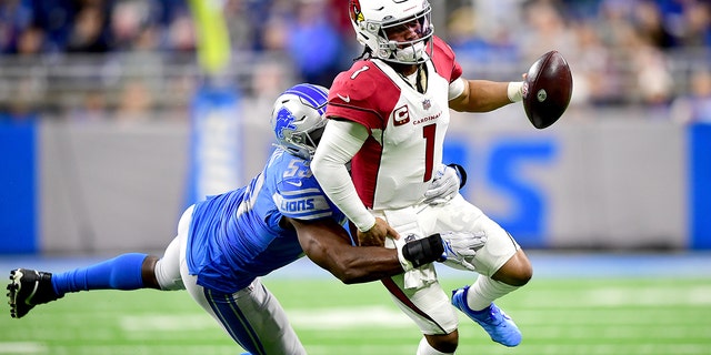 Charles Harris #53 of the Detroit Lions tackles Kyler Murray #1 of the Arizona Cardinals during the first quarter at Ford Field on December 19, 2021 in Detroit, Michigan.