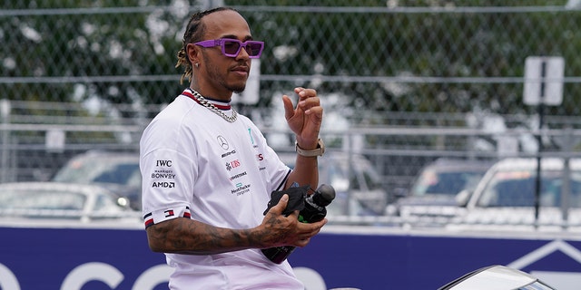 Mercedes driver Lewis Hamilton of Britain rides in the driver parade ahead of the Formula One Miami Grand Prix at the Miami International Autodrome, Sunday, May 8, 2022.