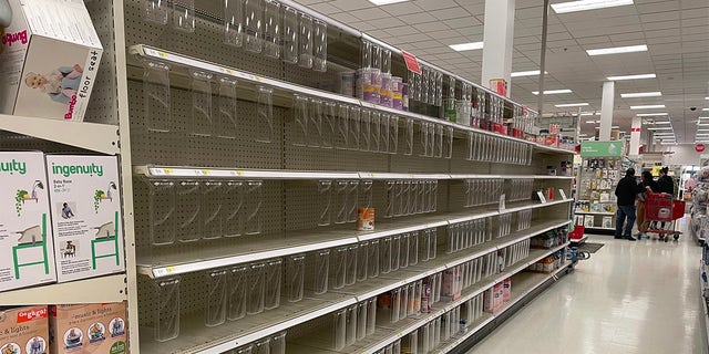 More parents are speaking out as the baby formula shortage crisis affects Americans in 2022. A Target in Long Island, N.Y., shows starkly empty formula shelves in the baby and toddler aisle of the store. 